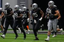 Las Vegas Raiders offensive tackle Kamaal Seymour (63), running back Josh Jacobs (28), offensiv ...