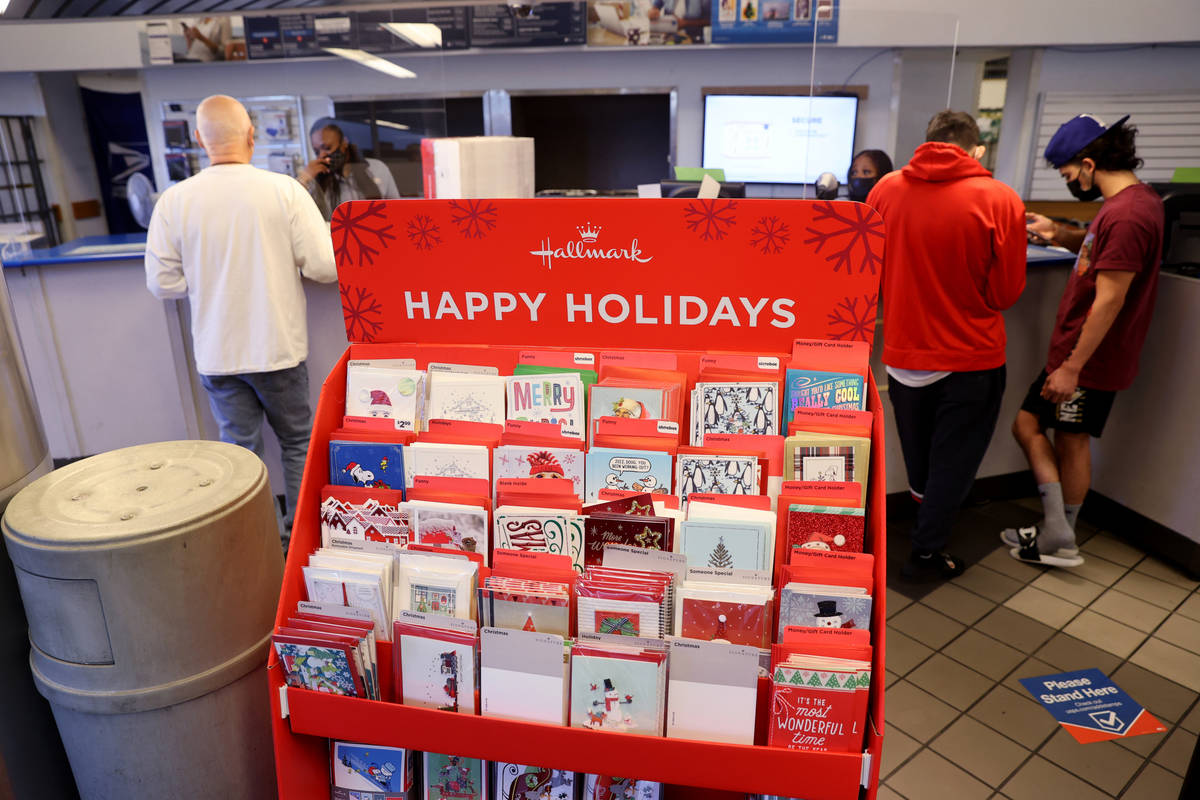 Customers ship packages at the main Las Vegas Post Office on Sunset Road Wednesday, Nov. 25, 20 ...