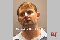 FILE - This file booking photo provided by the Alexandria, Va, Sheriff's Office, shows Peter De ...