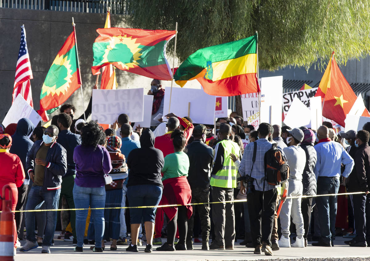 People gather outside of the Lloyd D. George Federal Courthouse to protest the attack against T ...