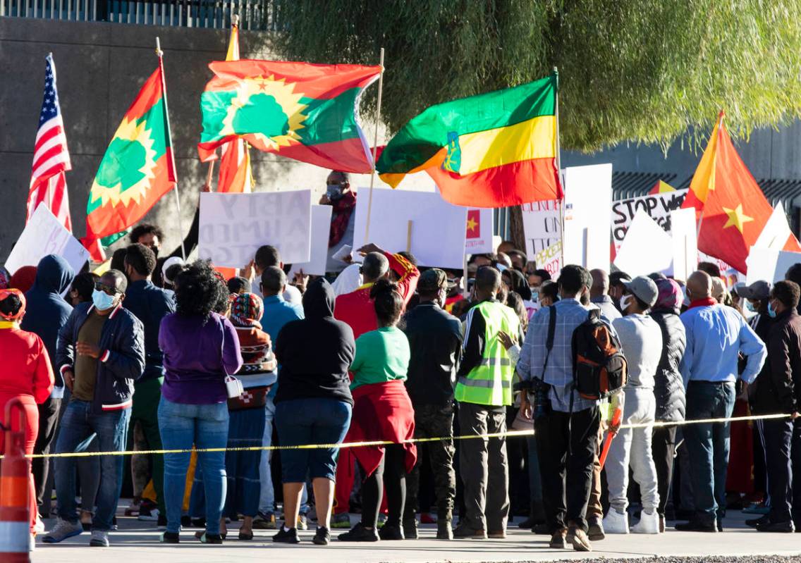 People gather outside of the Lloyd D. George Federal Courthouse to protest the attack against T ...