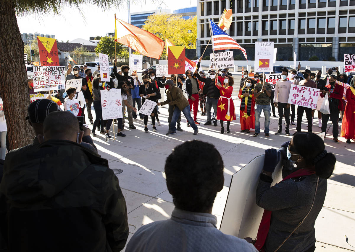 People gather outside of the Lloyd D. George Federal Courthouse to protest the attack against T ...