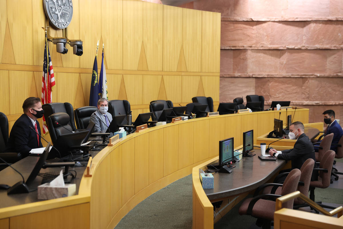 Las Vegas police detective Jason Leavitt, from left, Hearing Officer Spencer Judd, Chief Deputy ...