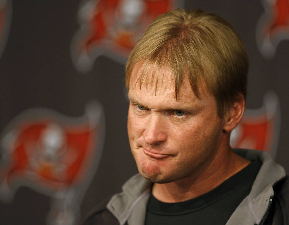 Tampa Bay Buccaneers head coach Jon Gruden grimaces as he speaks to the media during his weekly ...