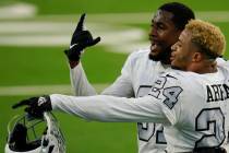 Las Vegas Raiders cornerback Isaiah Johnson, left, and strong safety Johnathan Abram (24) celeb ...