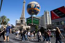 Tourist walk past Paris Las Vegas on Friday, Oct. 23, 2020, in Las Vegas. (Bizuayehu Tesfaye/La ...