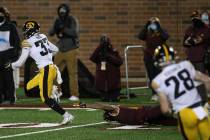Iowa defensive back Riley Moss (33) outruns Minnesota wide receiver Chris Autman-Bell (7) after ...