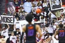 UNLV fans try to distract a Boise State Broncos player during the first half of a basketball ga ...