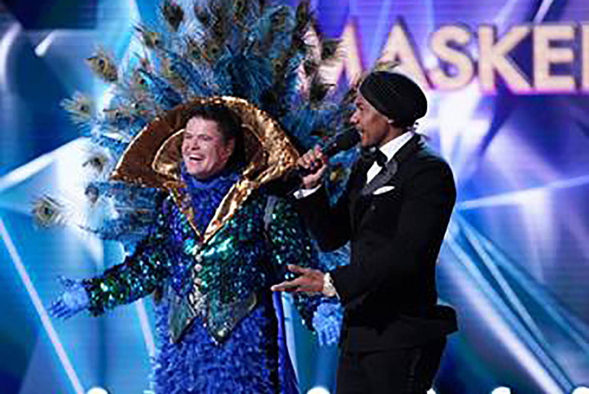 The Peacock is revealed as Donny Osmond during "The Masked Singer." With Osmond is host Nick Ca ...