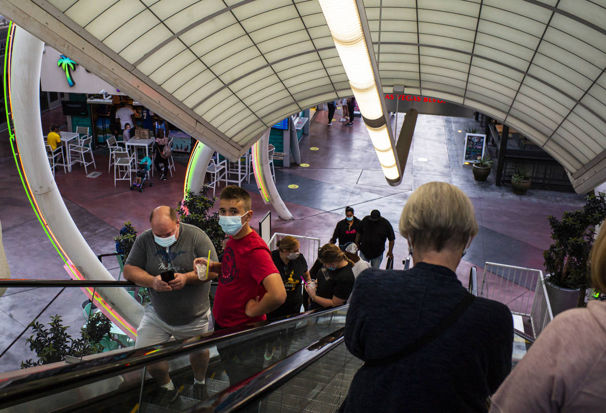 People take an escalator to Bally's on the Las Vegas Strip Thursday, Nov. 19, 2020. (Chase Stev ...