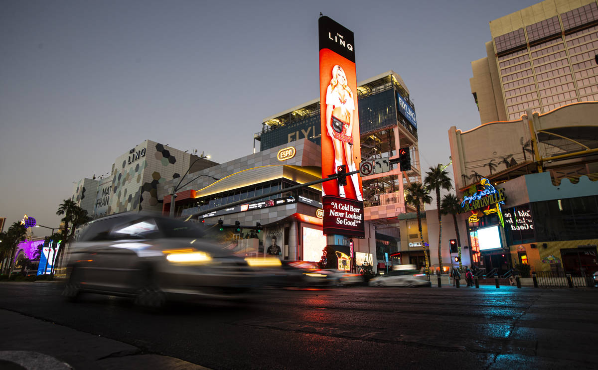 Traffic passes outside of The Linq Hotel along the Las Vegas Strip Thursday, Nov. 19, 2020. (Ch ...