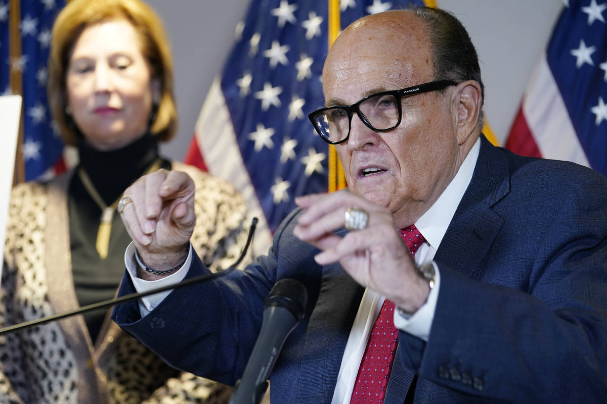 Former Mayor of New York Rudy Giuliani, a lawyer for President Donald Trump, speaks during a ne ...