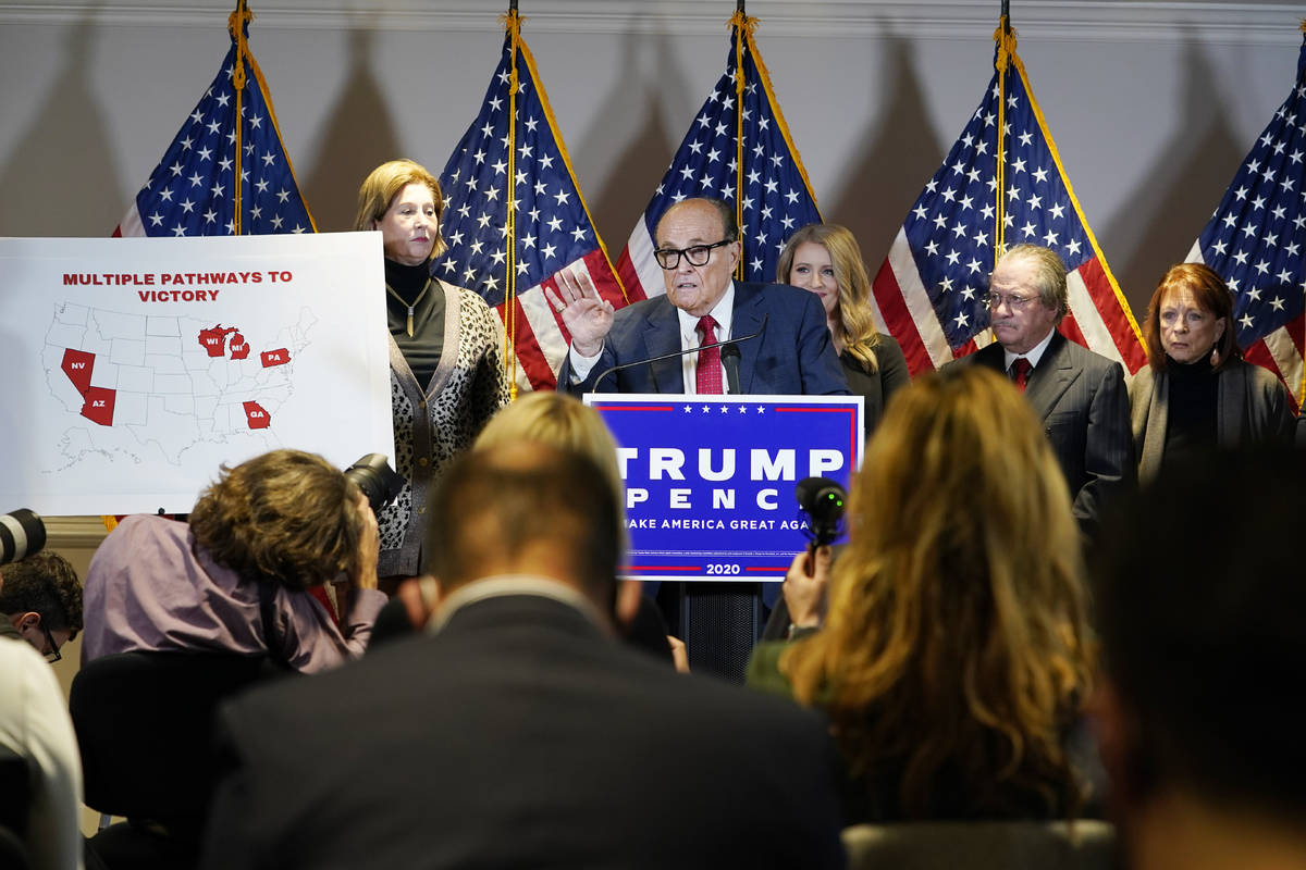 Former Mayor of New York Rudy Giuliani, a lawyer for President Donald Trump, speaks during a ne ...
