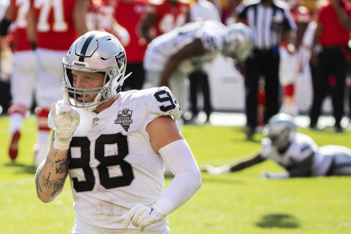Las Vegas Raiders defensive end Maxx Crosby (98) celebrates after a big defensive stop in the f ...