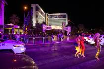 Las Vegas Strip visitors cross Las Vegas Boulevard outside The Mirage during Labor Day weekend ...
