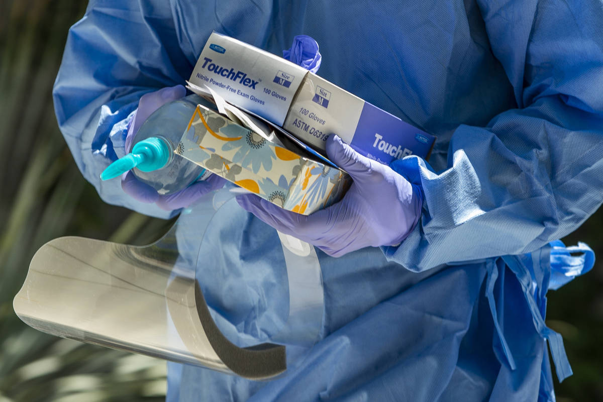 Nevada National Guard soldier PFC Nikolas Herrera carries tests and supplies during a walk-thru ...