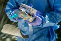 Nevada National Guard soldier PFC Nikolas Herrera carries tests and supplies during a walk-thru ...