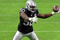 Las Vegas Raiders linebacker Nicholas Morrow #50 attempts to recover a fumble during the second ...