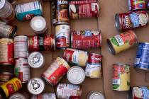 Local organizations will host drive-through food drive events this weekend. (Ellen Schmidt/Las ...