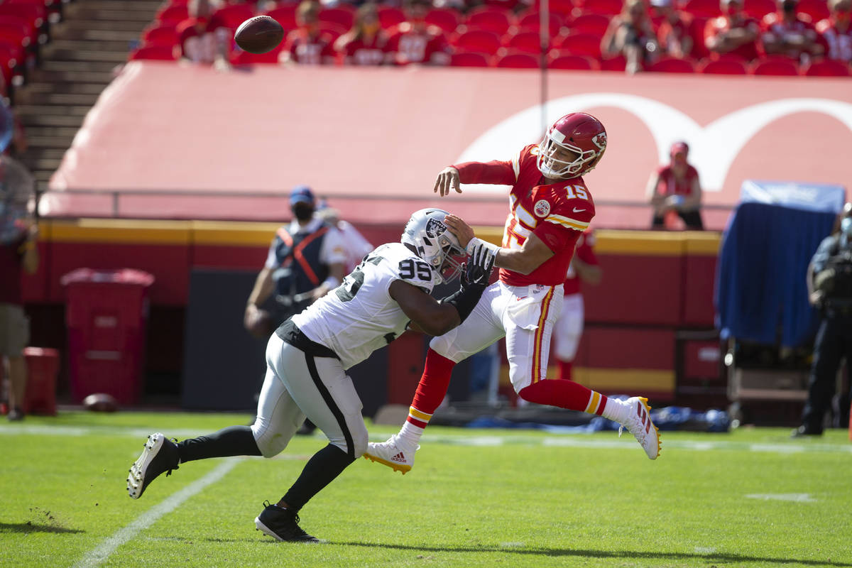 Las Vegas Raiders defensive end Datone Jones (95) pressures Kansas City Chiefs quarterback Patr ...