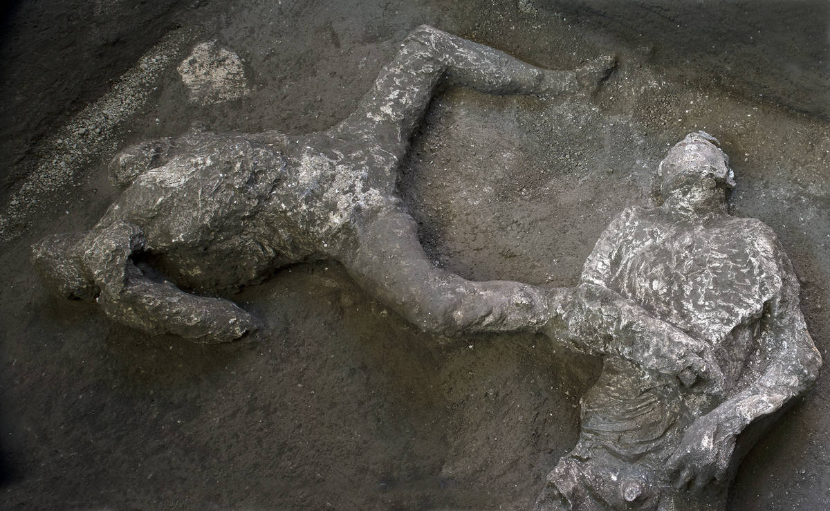 The casts of what are believed to have been a rich man and his male slave fleeing the volcanic ...