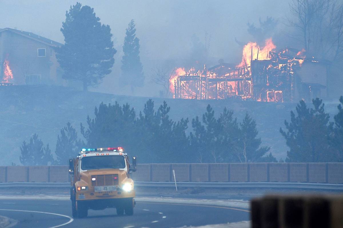 Firefighters battle the Pinehaven Fire in the Caughlin Ranch area of Reno on Tuesday, Nov. 17, ...