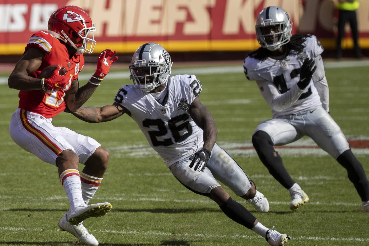 Las Vegas Raiders cornerback Nevin Lawson (26) and Las Vegas Raiders inside linebacker Cory Lit ...