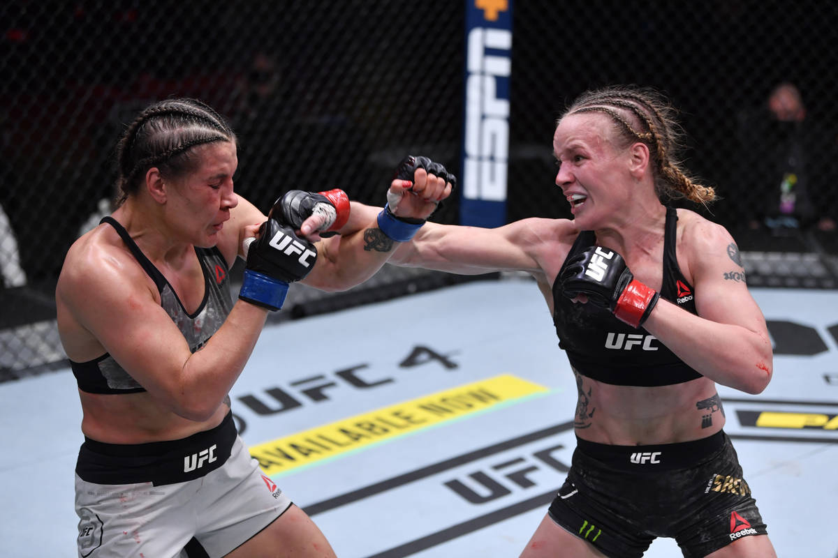 (R-L) Valentina Shevchenko of Kyrgyzstan punches Jennifer Maia of Brazil in their women's flywe ...