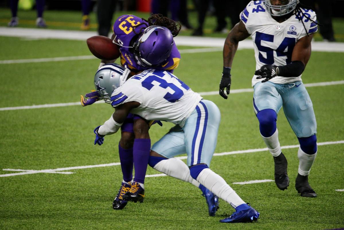 Minnesota Vikings running back Dalvin Cook (33) fumbles as he is hit by Dallas Cowboys safety D ...