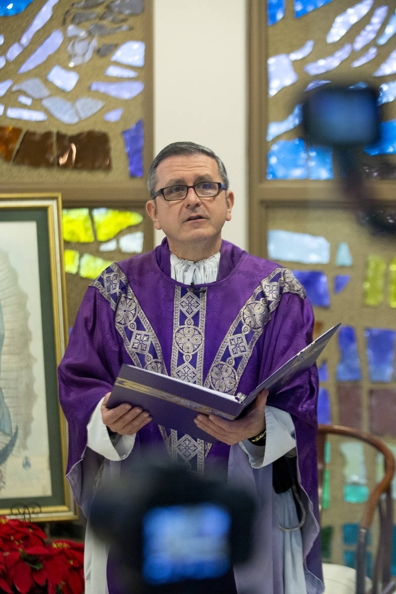 Cameras record Msgr. Gregory Gordon giving a virtual Mass at the The Roman Catholic Diocese of ...