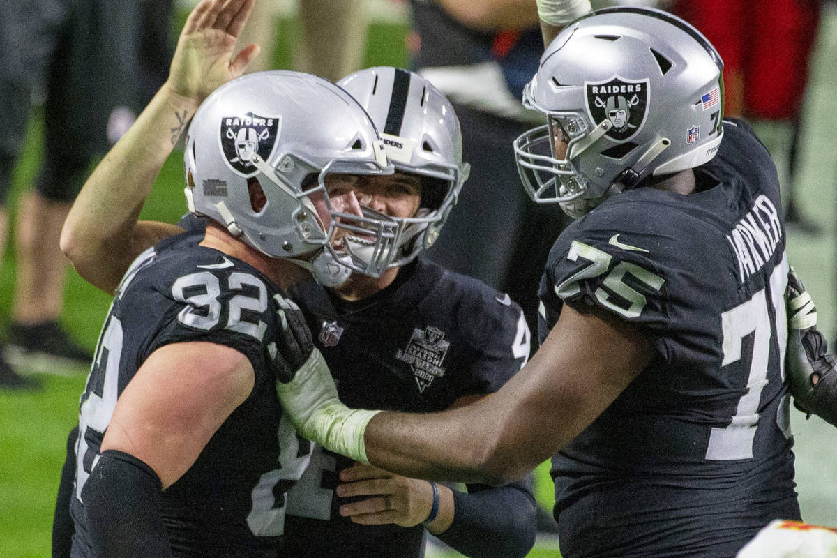 Las Vegas Raiders tight end Jason Witten (82) celebrates his touchdown score with quarterback D ...