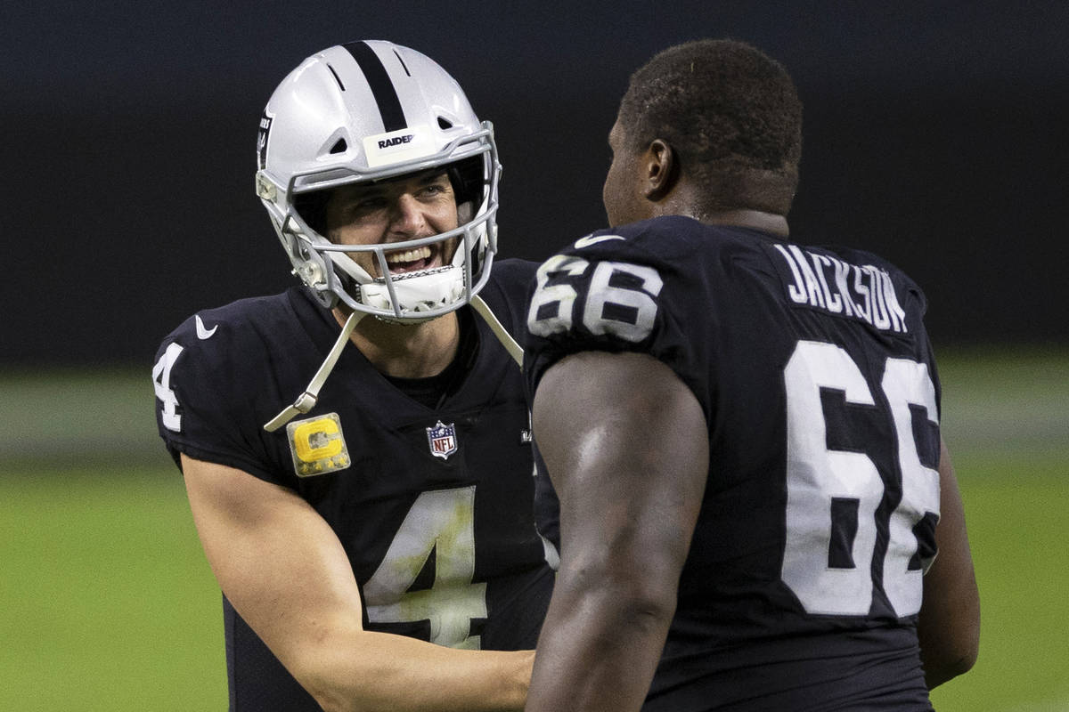 Las Vegas Raiders quarterback Derek Carr (4) celebrates with Las Vegas Raiders offensive guard ...