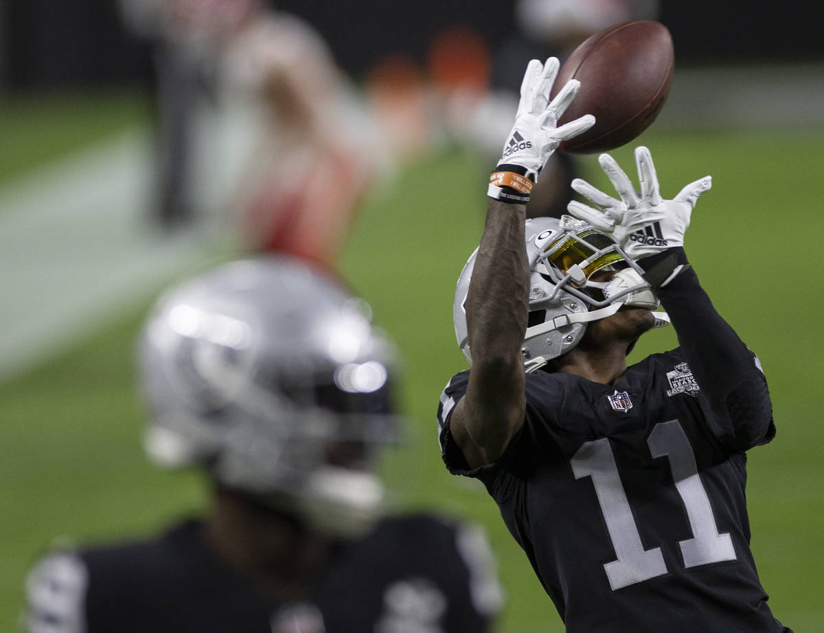 Las Vegas Raiders wide receiver Henry Ruggs III (11) warms up before the start of an NFL footba ...