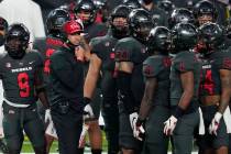 UNLV head coach Marcus Arroyo speaks with his players during the second half of an NCAA college ...