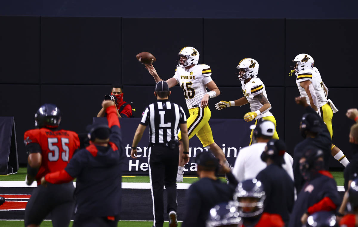 Wyoming Cowboys quarterback Levi Williams (15) celebrates a touchdown against the UNLV Rebels d ...