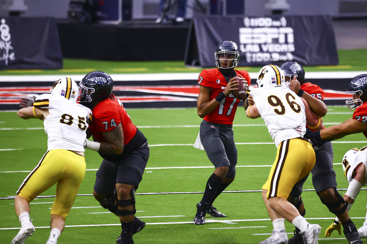 UNLV Rebels quarterback Doug Brumfield (17) looks to throw a pass against the Wyoming Cowboys d ...