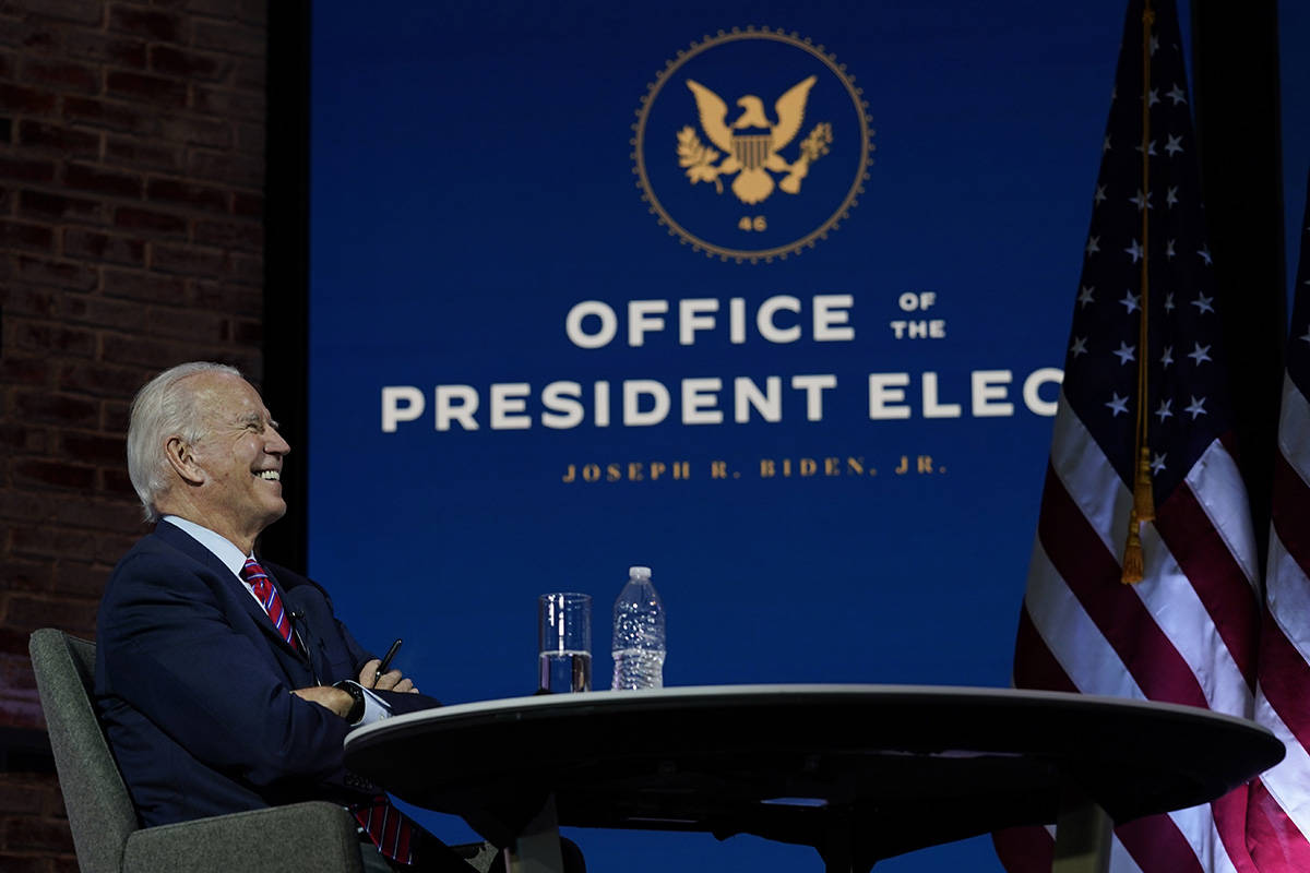 President-elect Joe Biden smiles as he meets virtually with the United States Conference of May ...