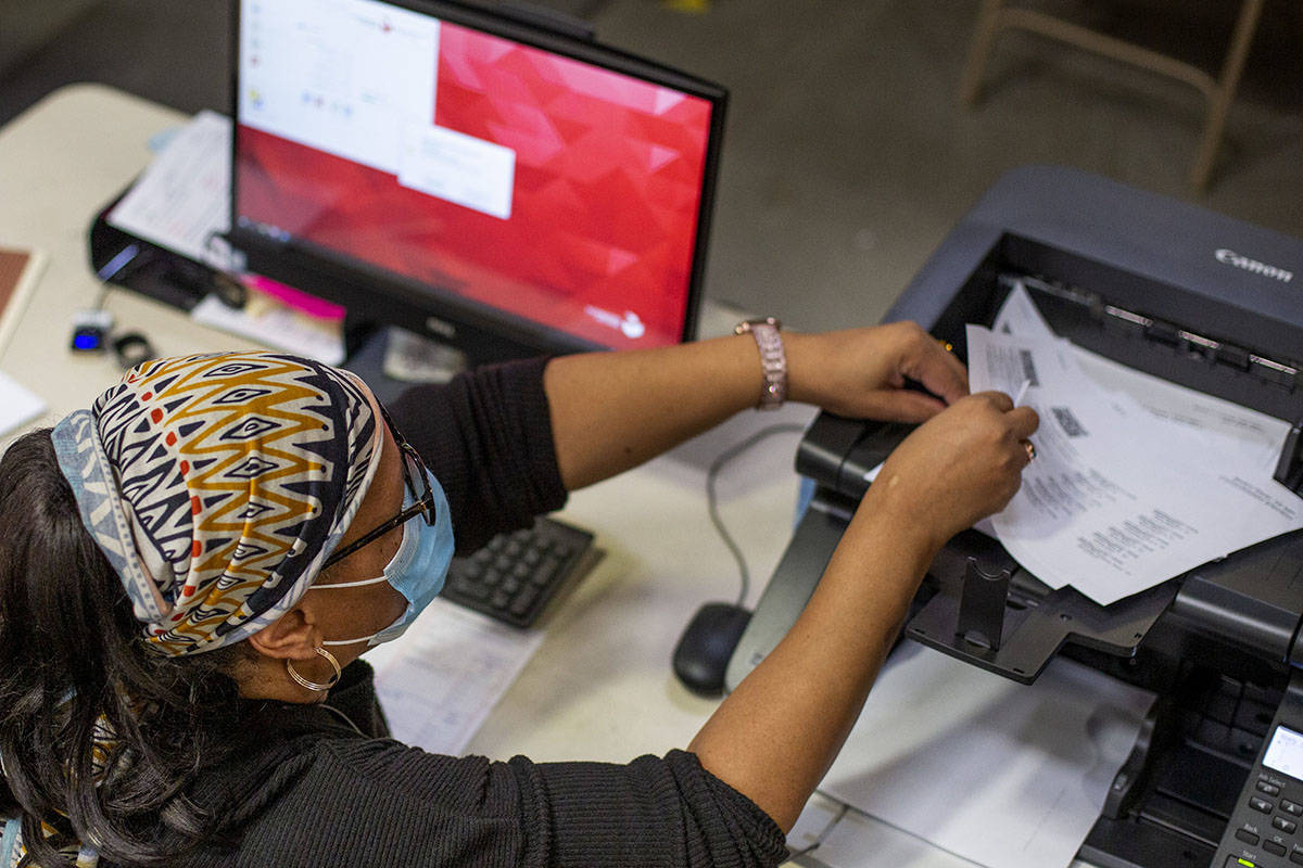 Mail-in ballots are counted at Clark County Election Center on Wednesday, Nov. 4, 2020, in Las ...