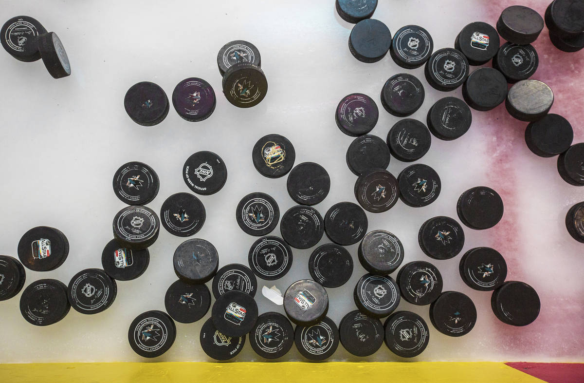Golden Knights practice pucks lay on the ice before the start of morning skate ahead of game on ...