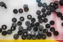 Golden Knights practice pucks lay on the ice before the start of morning skate ahead of game on ...