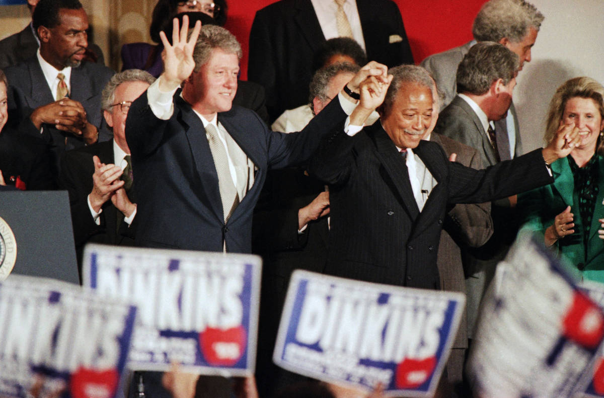 FILE - In this Thursday, Oct. 28, 1993, file photo, President Bill Clinton holds up four finger ...