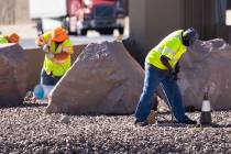 Workers from the Nevada Department of Transportation (NDOT) replace copper wire after Spaghetti ...