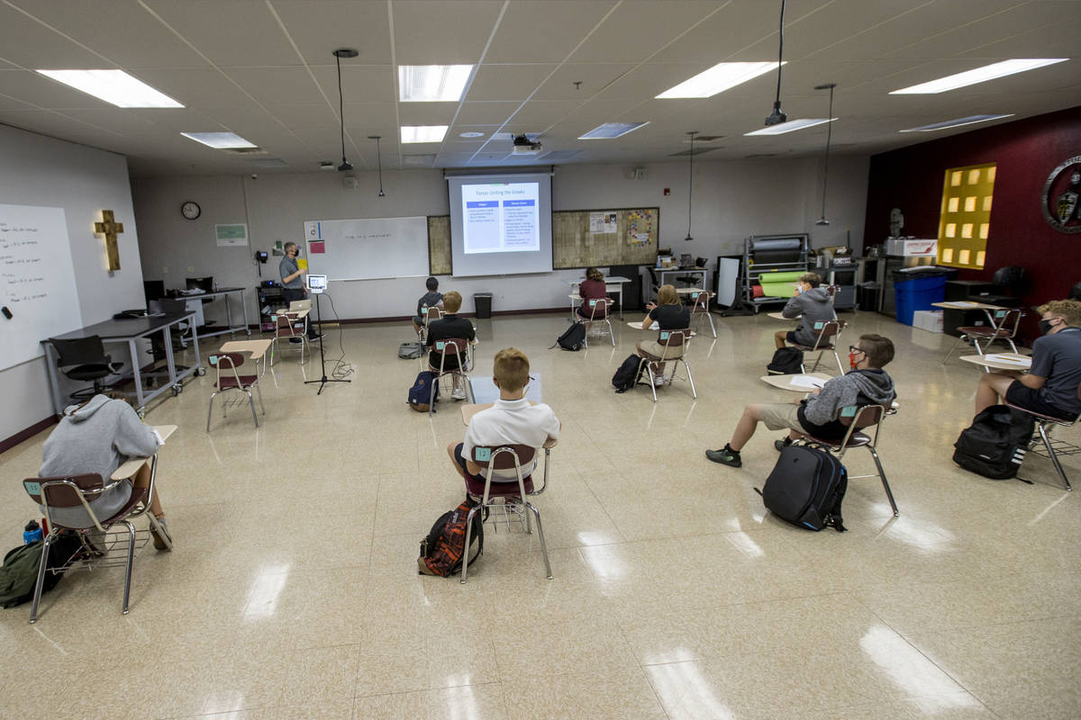 In this Sept. 24, 2020, file photos, students keep socially distanced while attending Joel Arno ...