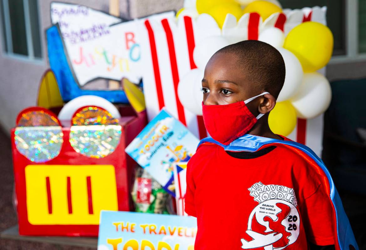Five-year-old Justyn Boumah, who led a read-a-thon fundraiser, poses for a portrait at his home ...