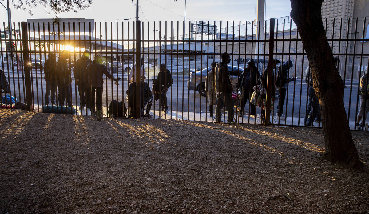 People line up outside to receive Thanksgiving meals and clothing at the Las Vegas Rescue Missi ...