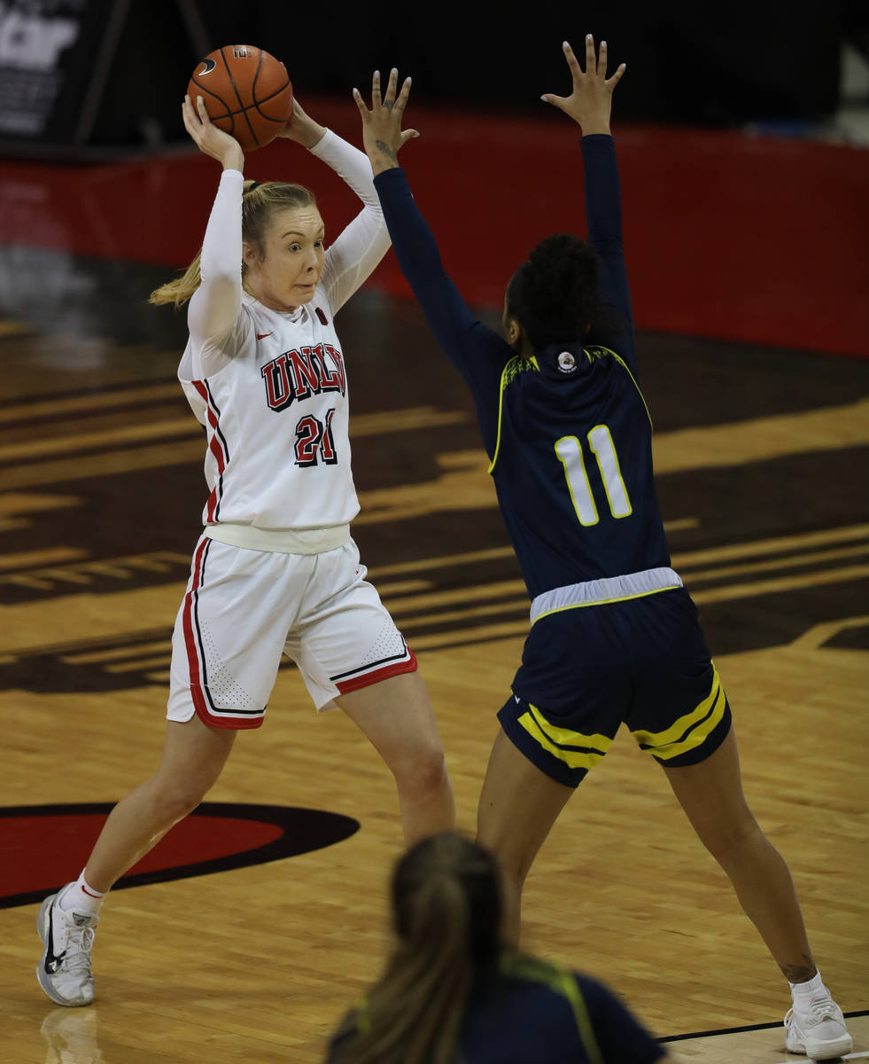 UNLV Lady Rebels forward Delaying Byrne (21, left) gets over the top of Northern Arizona Univer ...