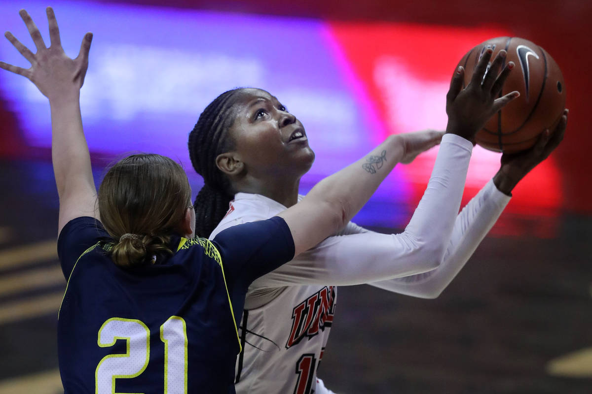 Northern Arizona University guard Jacey Bailey (21, left) tries to block UNLV Lady Rebels forwa ...