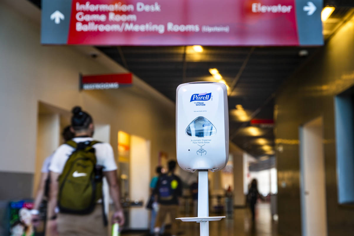 A hand sanitizer dispenser is installed for use at the entrance to the UNLV Student Union build ...
