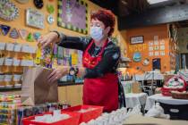 Co-founder of All Fired Up Gail Schomisch packs a holiday pottery to-go kit in the pottery stud ...