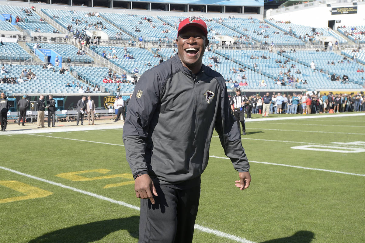 Atlanta Falcons assistant head coach Raheem Morris watches warmups before an NFL football game ...